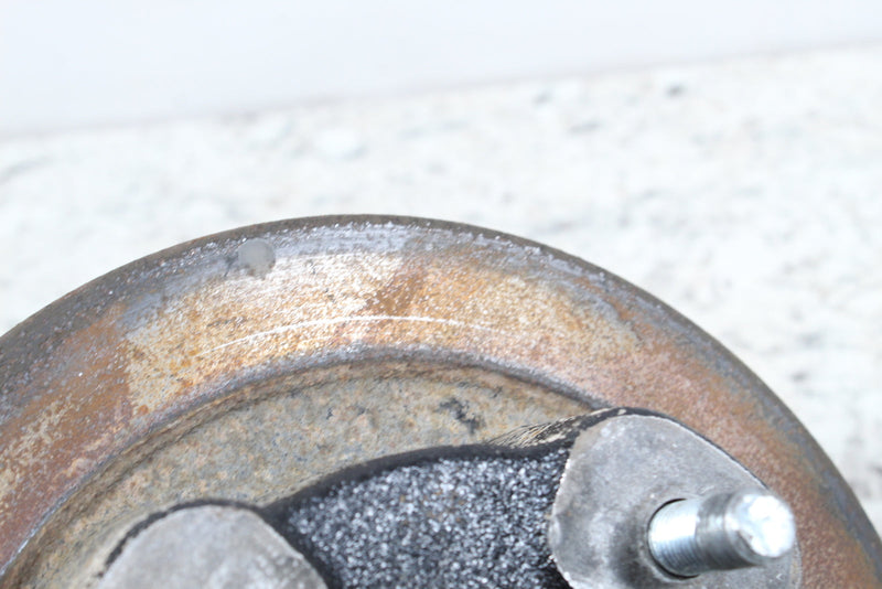 Worn, rusty brake drum.
