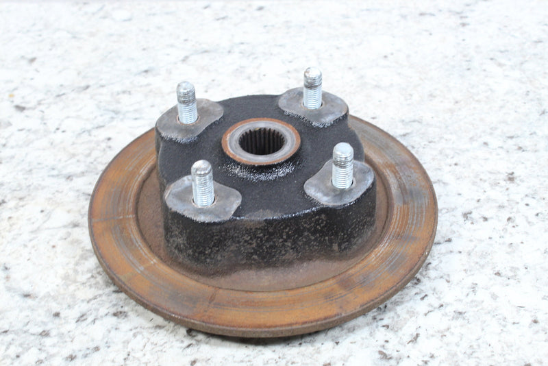 Rusty brake rotor with hub and studs.