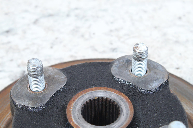 Automotive wheel hub with studs.