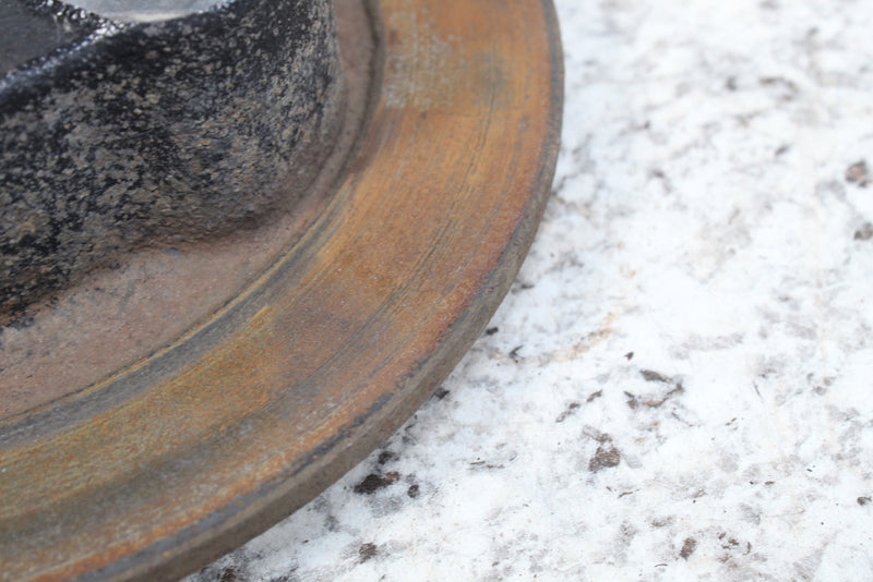 Rusted, worn brake rotor.
